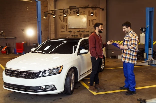 Male customer auto service center explaning problems his car mechanic with clipboard 496169 1047